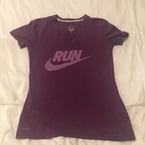 Nike running Dri-Fit T-shirt short sleeve in purple with Run saying and swoosh